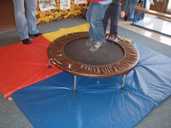 Picture of student jumping on trampoline